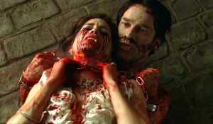 Bill Compton holding Lorena Krasiki right before Sookie Stackhouse ends her existence on True Blood.